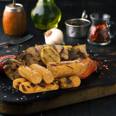 Grilled sausages and assorted meat on a wooden board, bazaar ramadan food