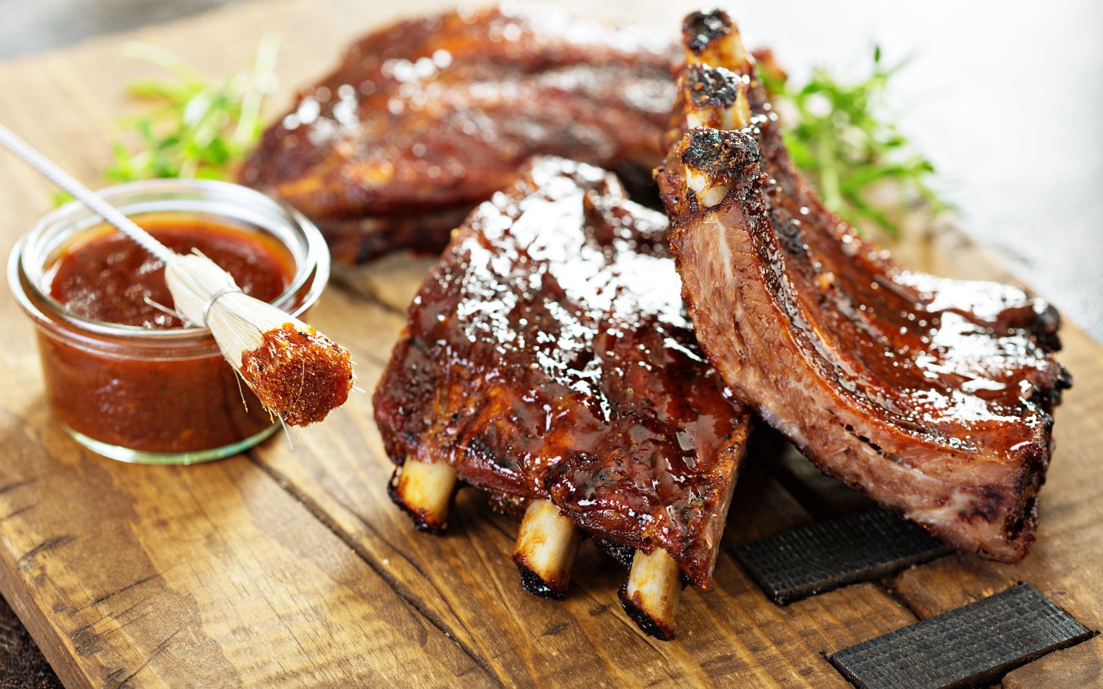 Weekday buffet dinner, this month's theme featuring grilled meats, bbq barbecue beef ribs with barbecue sauce on the side.
