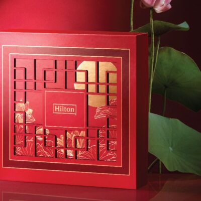Hilton DoubleTree 2023 national mooncake box, image features a crimson red oriental box with a stalk of lily on the side