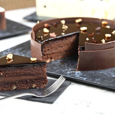 dark chocolate brownie decorated with hazelnut