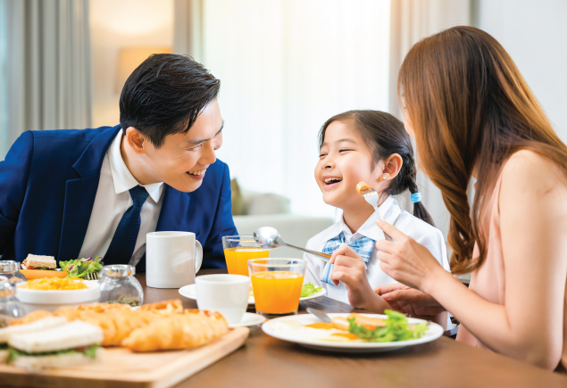 Father's day brunch, image features father talking to child and mother over food