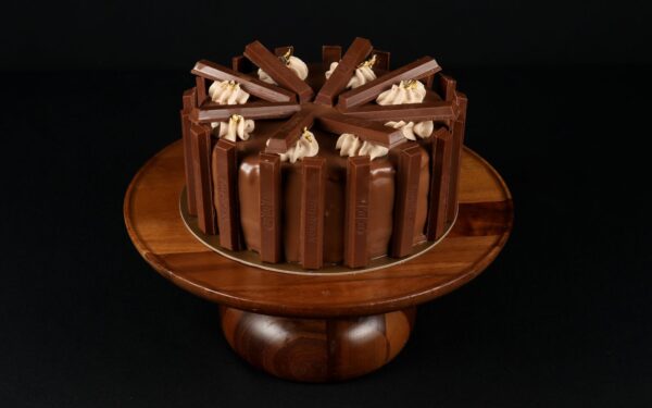 Kit Kat Tall Cake - Topped with a glossy milk chocolate glaze and garnished with Kit Kat bars.
