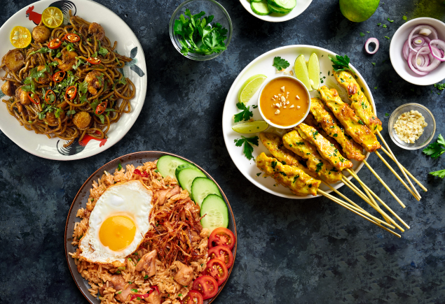 Three different types of Malaysian dish such as Mee Goreng, Chicken Satay and Kampung Fried Rice.