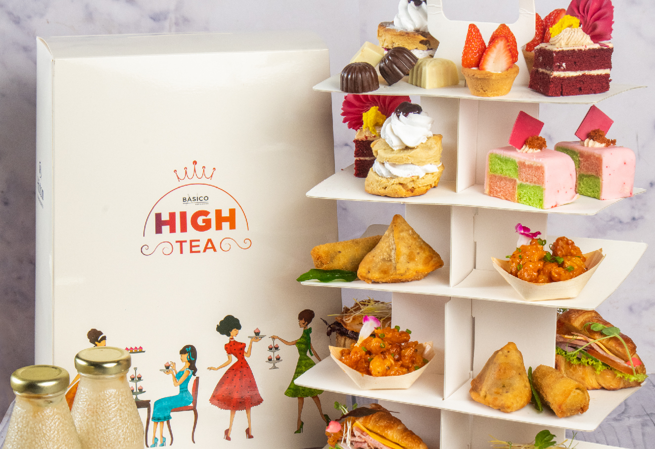 Takeaway high tea set that includes a variety of desserts and finger bites.