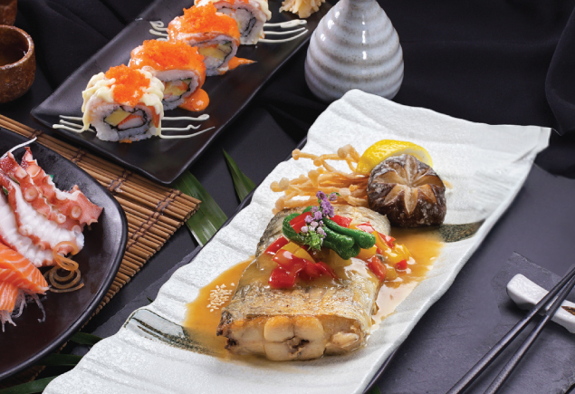 japanese dishes of fish, sushi roll and sashimi