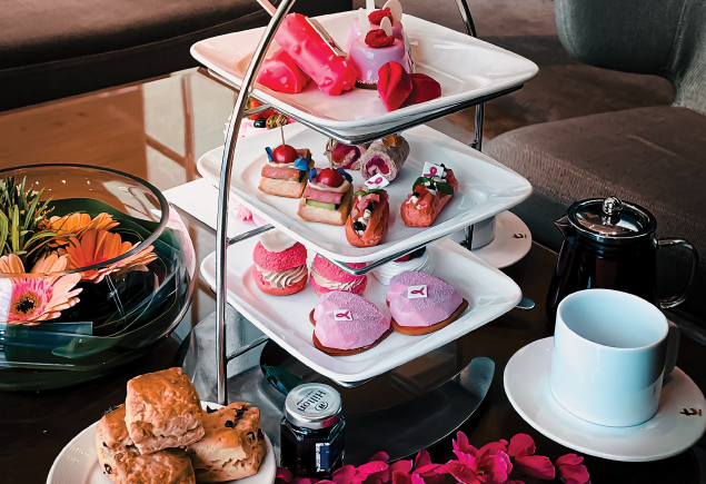 Three tiers of high tea with Breast Cancer Awareness month theme.