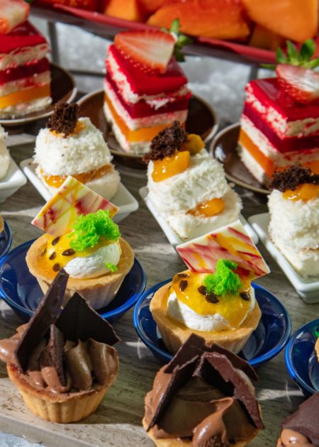 A variety of mini tarts and cakes.