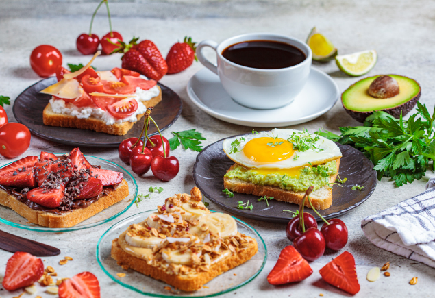 A variety of breakfast food with a cup of coffee.