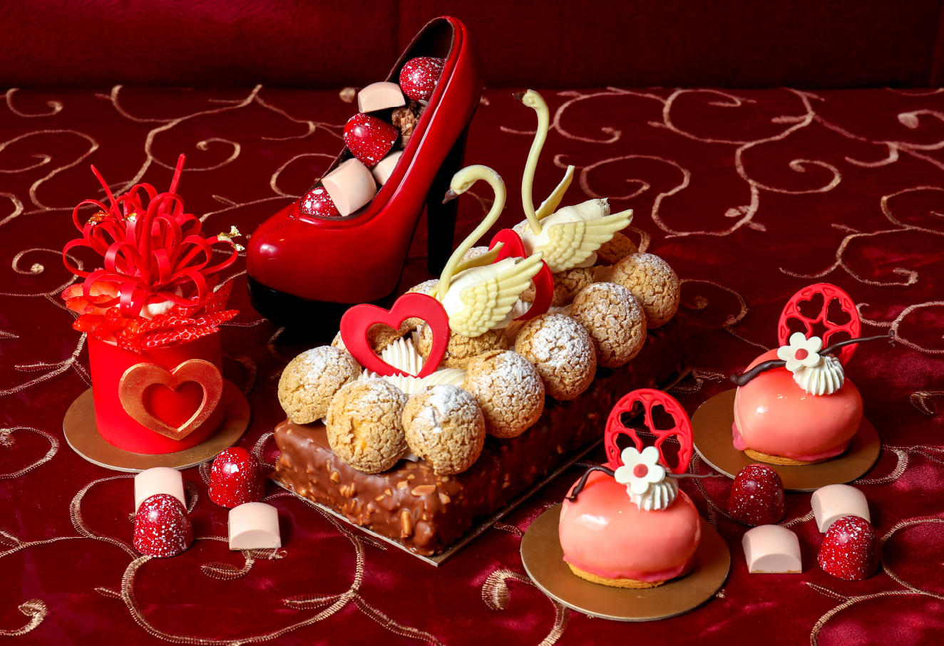 The photo shows a variety of Valentine's Day desserts.