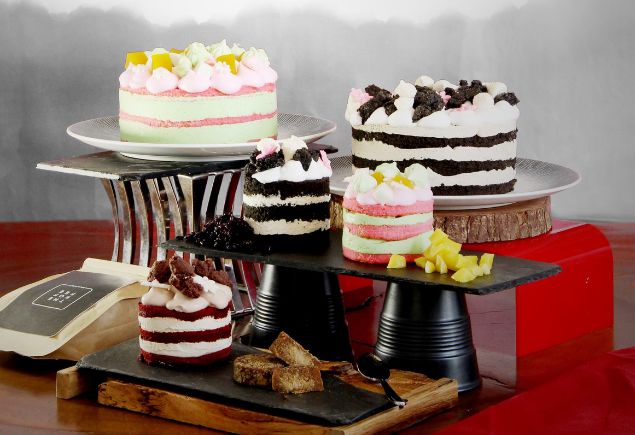 Five types of different cakes are on the stand