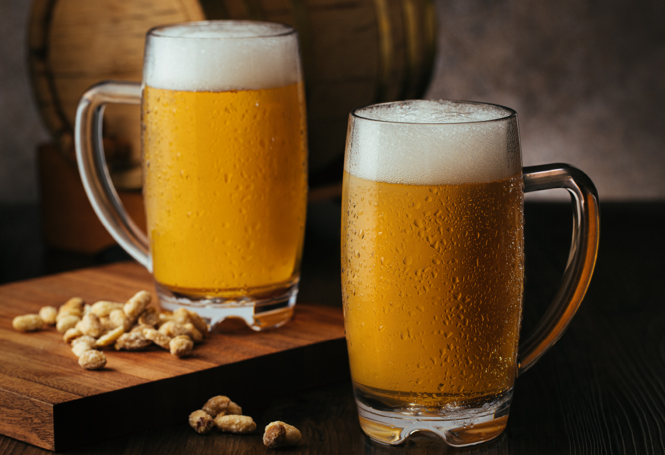 Two mugs of beer on a table