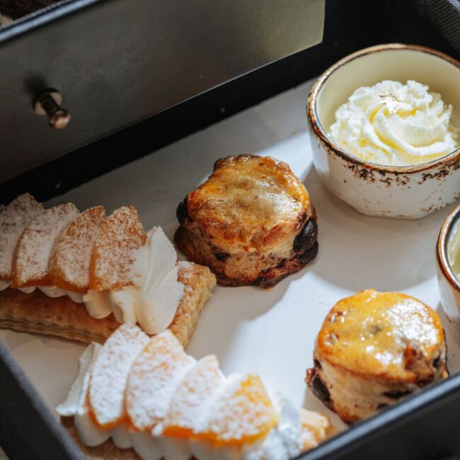 From the left, it's Peach Mango Strudel, Warm Chocolate Walnut Scones and Clotted Cream. Each of the item comes in two pieces.
