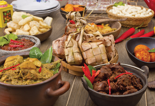 A variety of Raya food such as ketupat, curry, rendang, sambal telur and keropok.