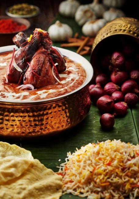 Briyani Rice with Tandoori Chicken, Curry and Papadam.