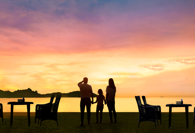 A silhouette of a family of three.
