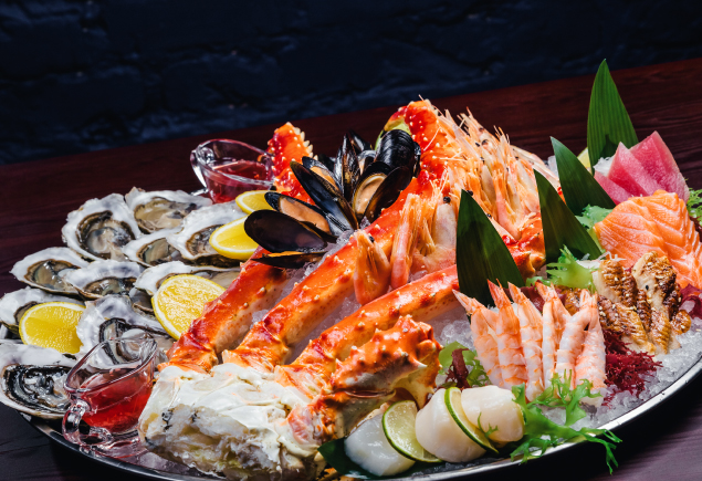 A plate full of fresh seafood ingredients.