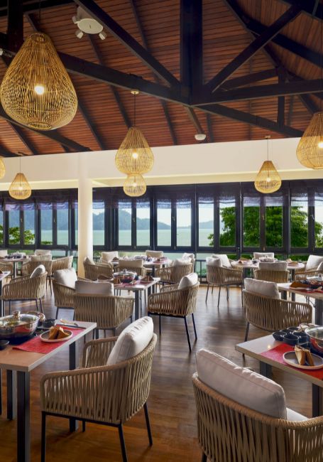 DoubleTree Hilton Damai Laut Hotpot outlet with spacious seating area and seaview.