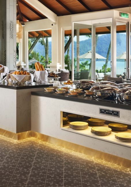 DoubleTree Damai Laut Makan Kitchen outlet showing a spread of buffet and sea view