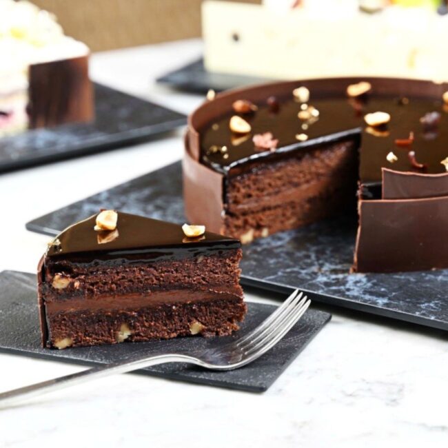 A whole cake of dark chocolate brownie.