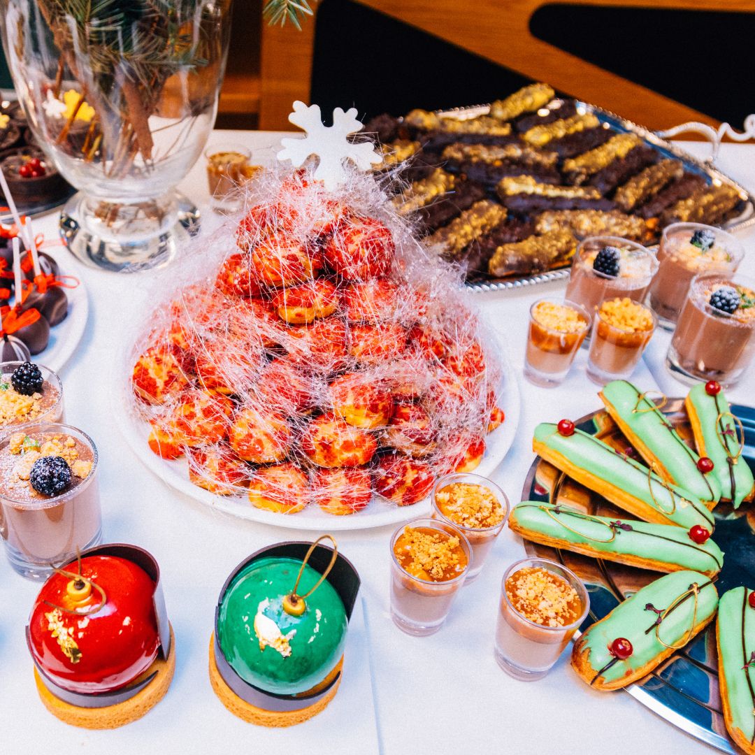 The photo shows a variety of Christmas dessert on the table.