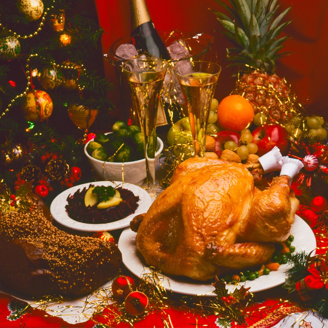 The photo shows a whole turkey with Christmas decorations on the table.