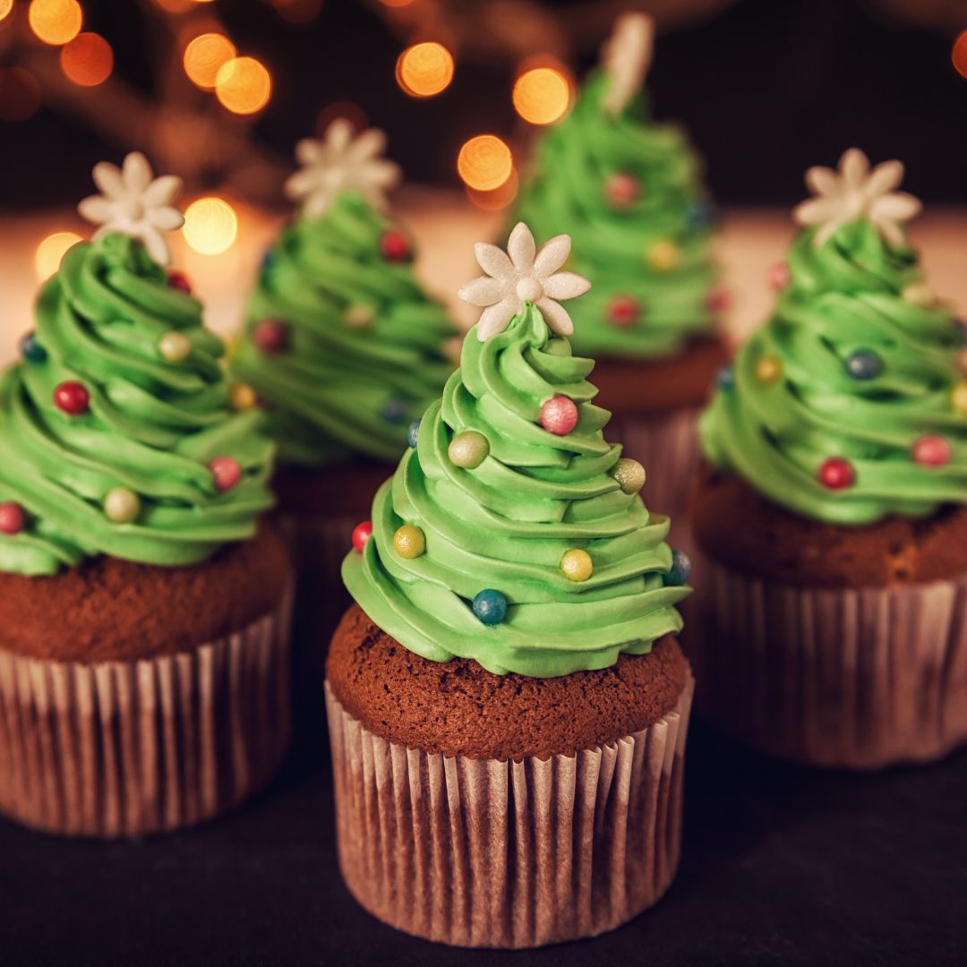 The photo shows a few Christmas themed cupcakes.