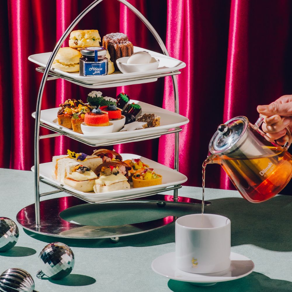 high tea tier with classic favourites such as scones, sandwiches, macaroons, premium dilmah tea and more.