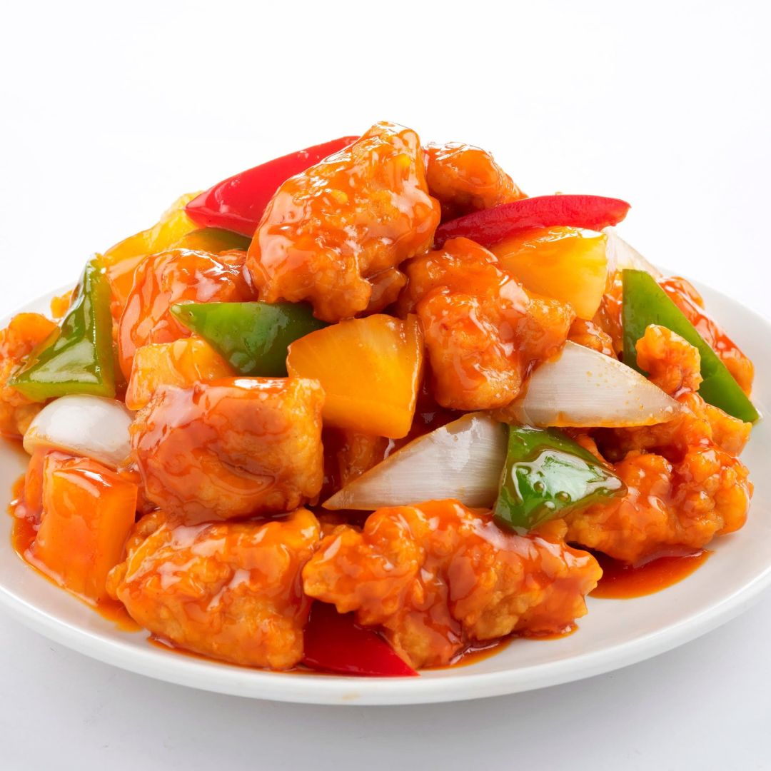 A plate of sweet and sour pork.
