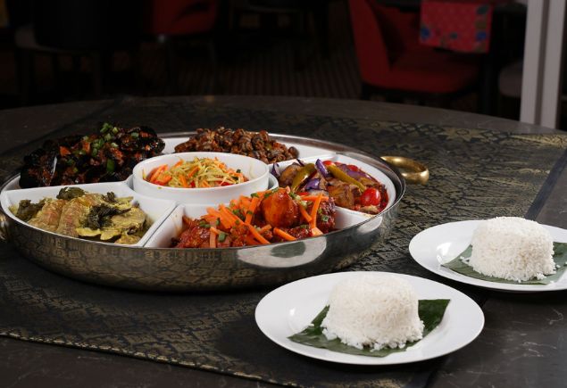 Hilton PJ's Ramadan private dining set menu. The photo shows five different dishes and two plates or white rice.
