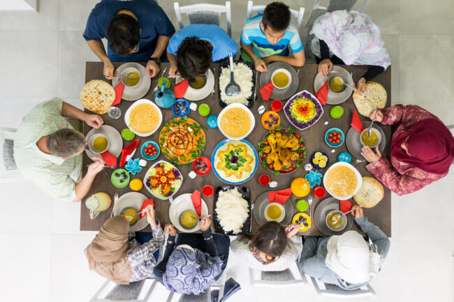 A family is having a buka puasa dinner together.