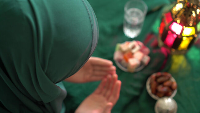 A Muslim lady is praying. 