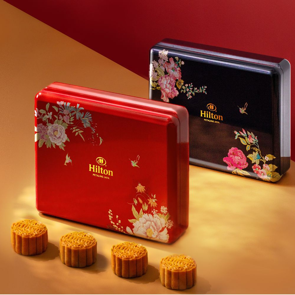 Hilton Petaling Jaya 2023 mooncake box. The box comes in red and blue colour and floral designs are imprinted on it.