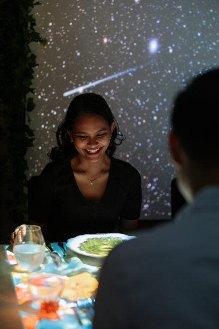 a smiling girl dining at the banquet of hoshena hilton kuala lumpur