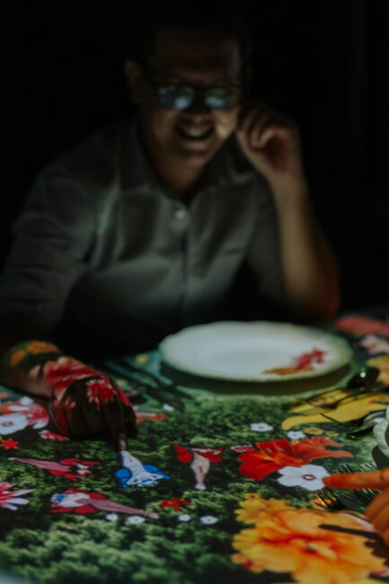 a man smilling and dining at the banquet of hoshena hilton kuala lumpur